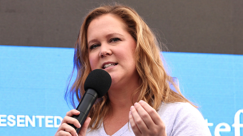 Amy Schumer speaking on stage