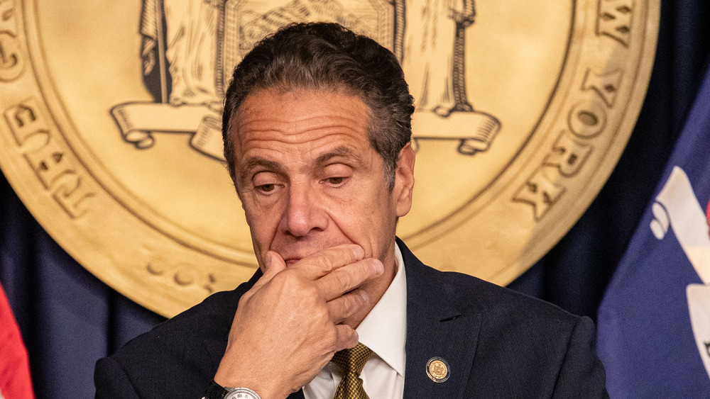 Andrew Cuomo with hand over his mouth