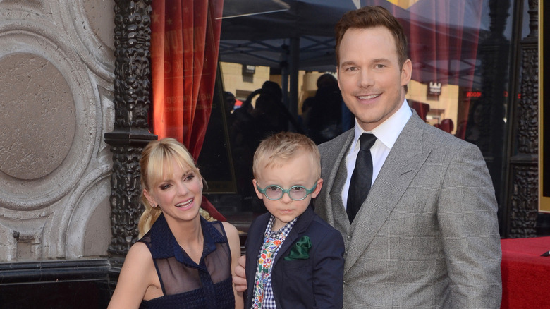 Anna Faris, Jack Pratt & Chris Pratt kneel at the Hollywood Walk of Fame