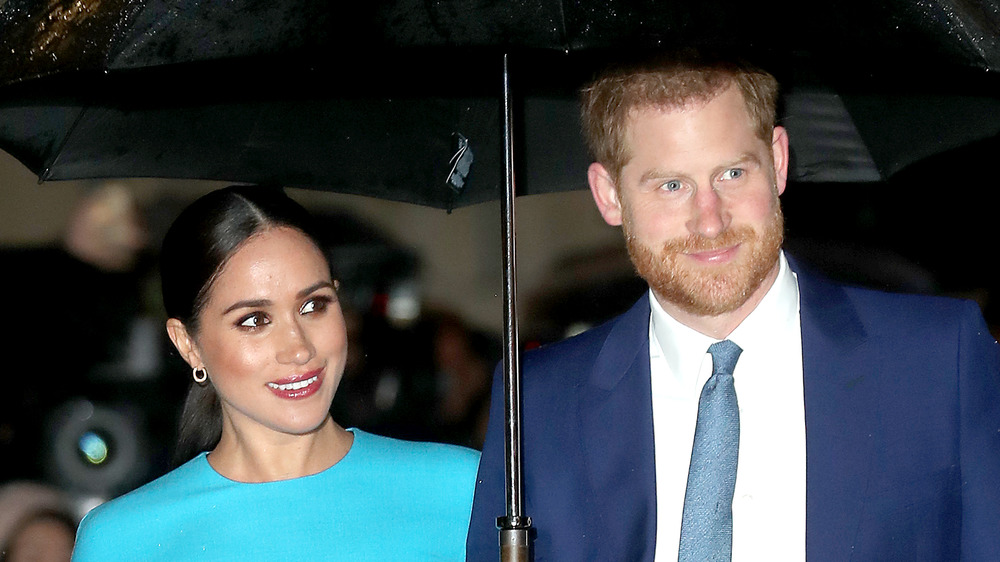 Prince Harry and Meghan Markle smiling