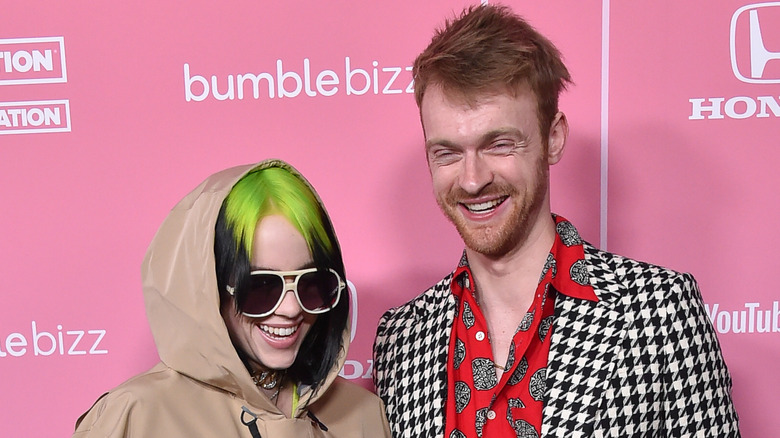 Billie Eilish and Finneas smiling