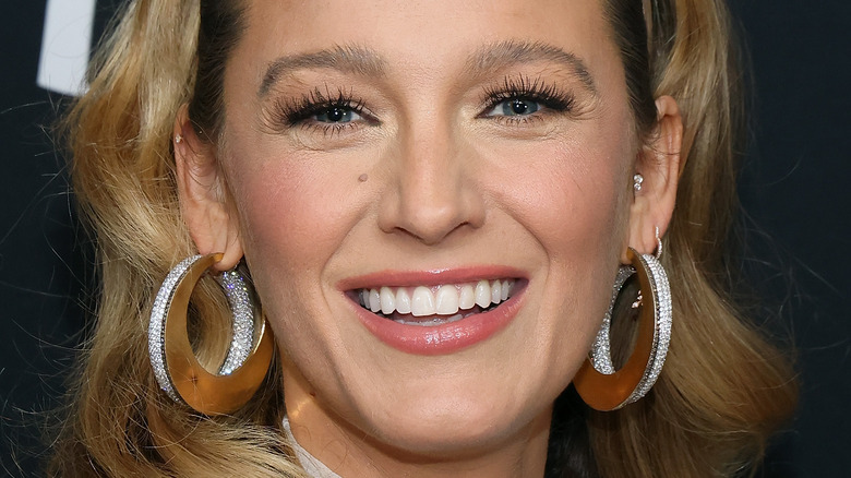 Blake Lively smiles with oversized earrings