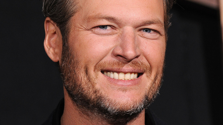 Blake Shelton smiles at an event