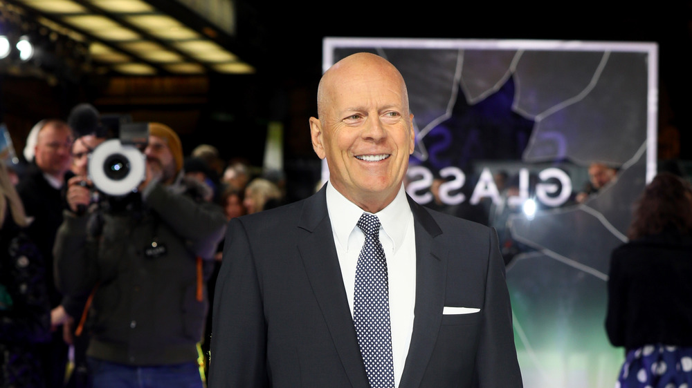 Bruce Willis smiles on red carpet