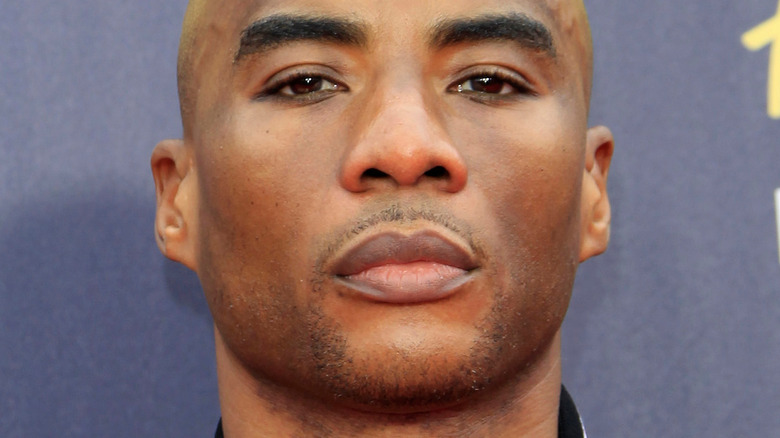 Charlamagne tha God poses