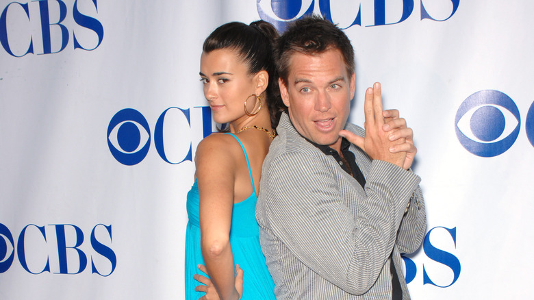 Cote de Pablo and Michael Weatherly pose on the red carpet