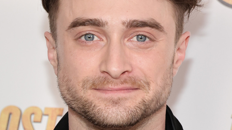 Daniel Radcliffe poses at an event