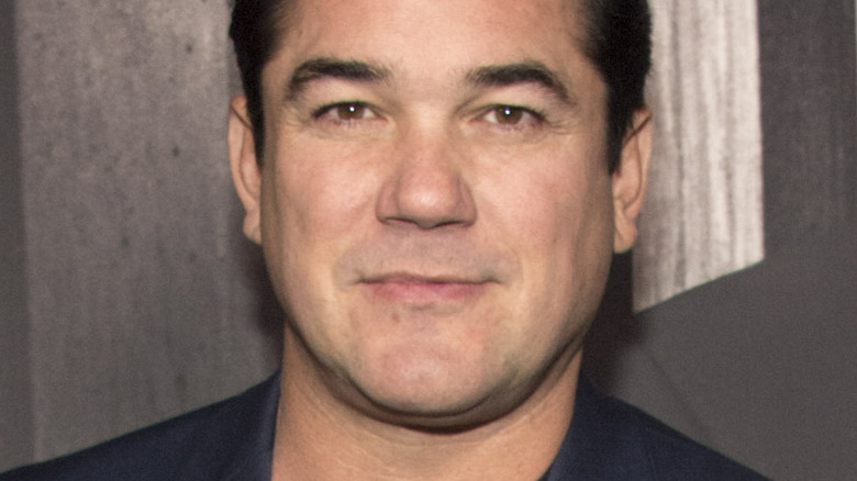 Dean Cain with slight smile on the red carpet