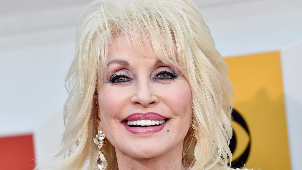 Dolly Parton smiling on the red carpet