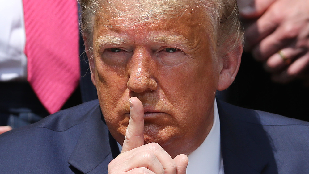 Donald Trump with finger to his mouth