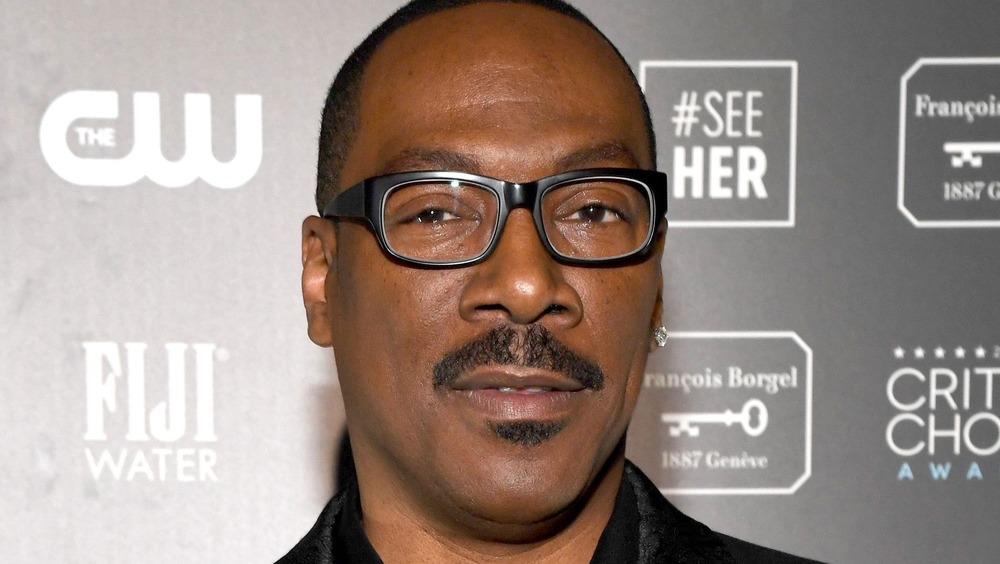 Eddie Murphy posing on the red carpet at the Lifetime Achievement Awards