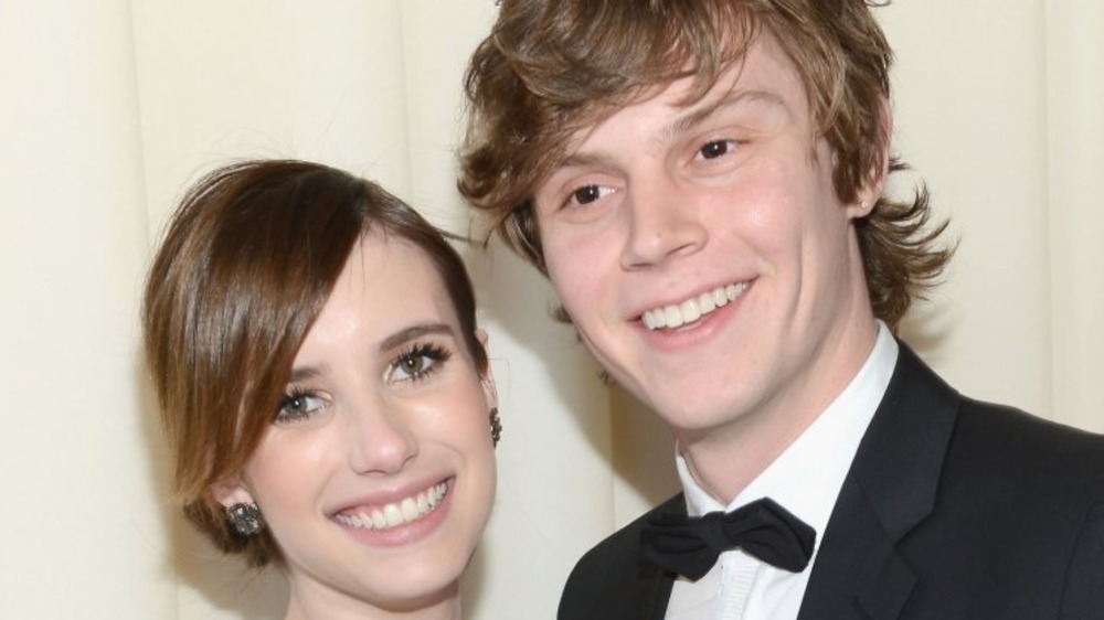 Emma Roberts and Evan Peters smiling 