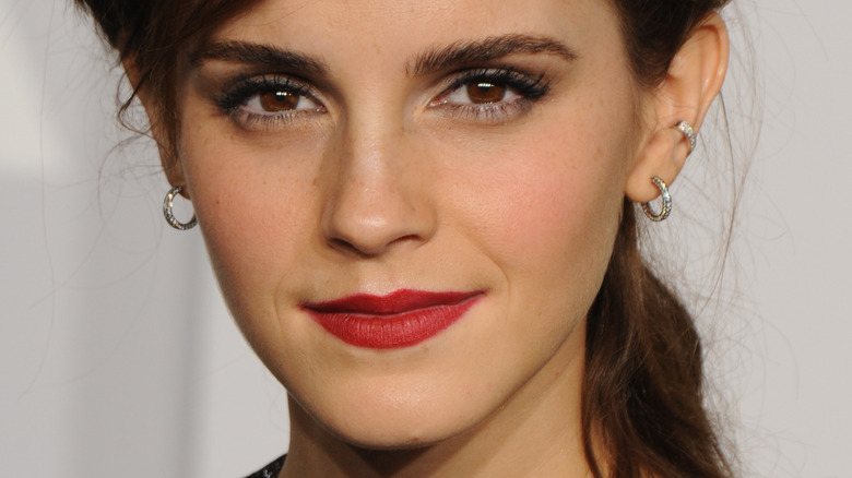 Emma Watson poses with red lipstick