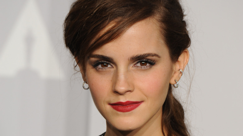 Emma Watson poses with red lipstick