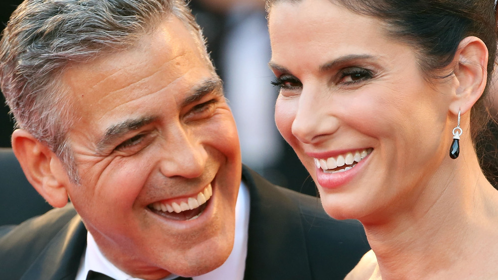 George Clooney and Sandra Bullock laughing