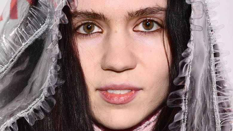 Grimes with a neutral expression