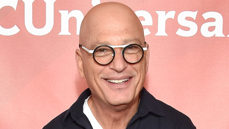 Howie Mandel smiles on the red carpet