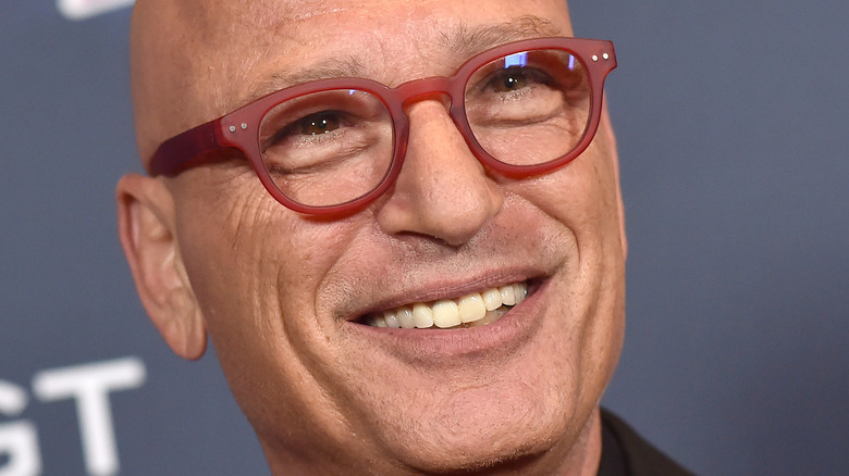 Howie Mandel smiles on the red carpet