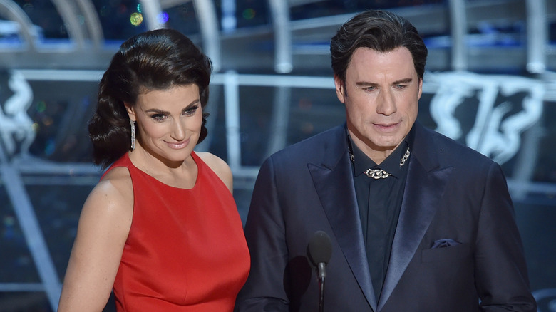 Idina Menzel and John Travolta on stage
