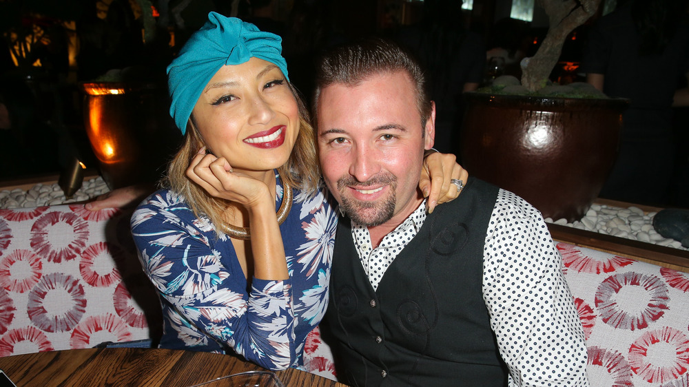 Jeannie Mai and ex-husband Freddy Harteis smiling