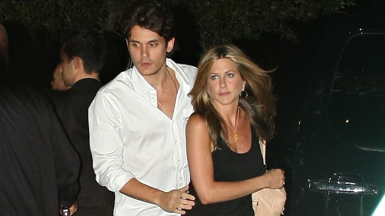John Mayer and Jennifer Aniston looking annoyed 
