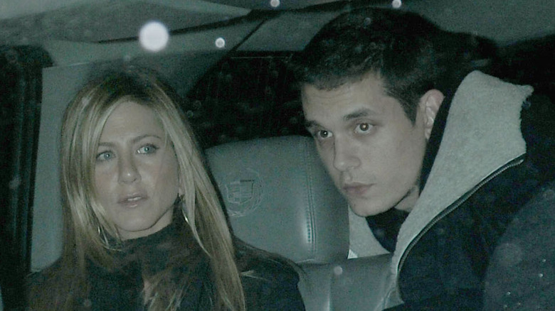 Jennifer Aniston and John Mayer in the backseat of a car