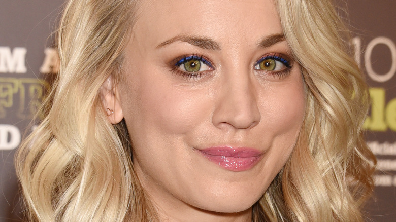 Kaley Cuoco smirky smile looking at camera