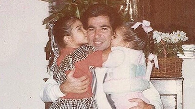 Kim and Khloé Kardashian with their dad