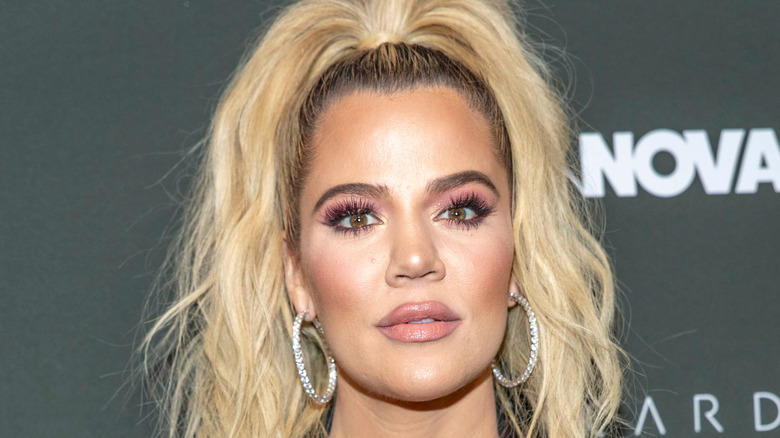 Khloe Kardashian with a serious expression