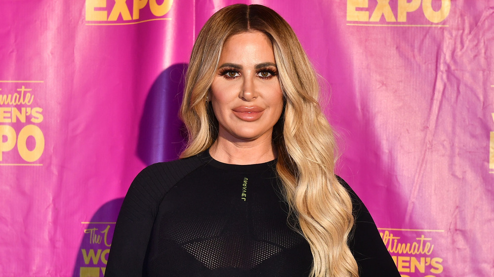 Kim Zolciak-Biermann poses on the red carpet