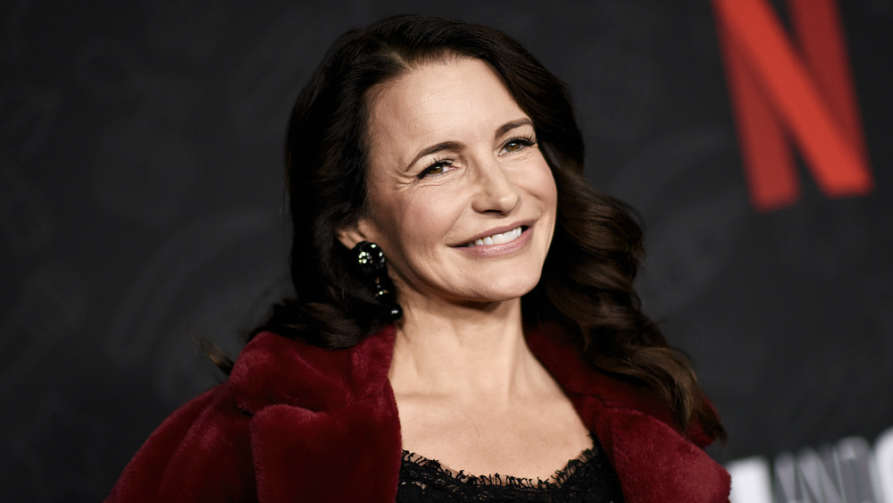 Kristin Davis smiling over shoulder