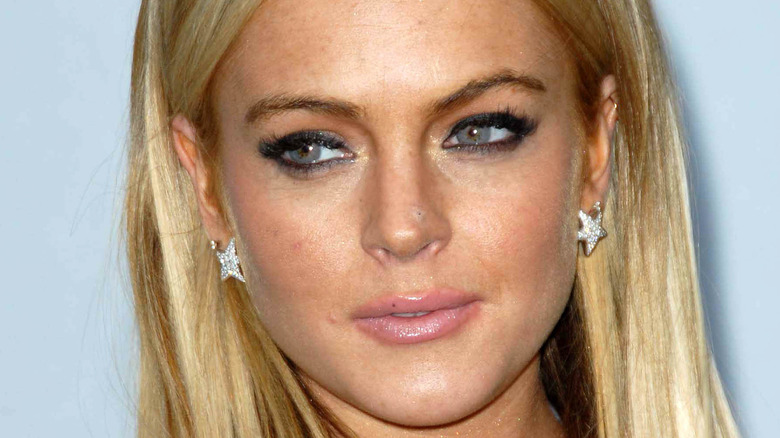 Lindsay Lohan wearing star earrings