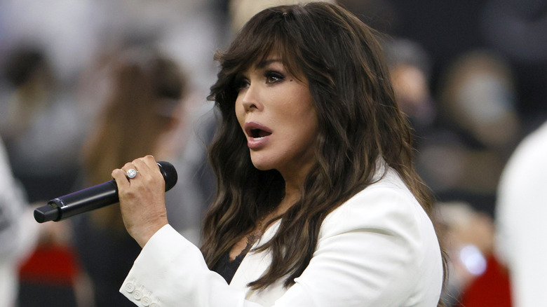 Marie Osmond singing the national anthem before a football game.