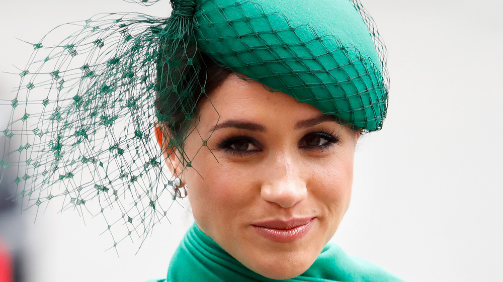 Meghan Markle wearing a green hat