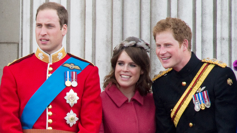 Prince William, Princess Eugenie and Prince Harry on the Buckingham Palace balcony in happier times.