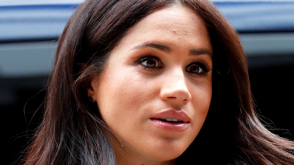 Meghan Markle with a serious expression