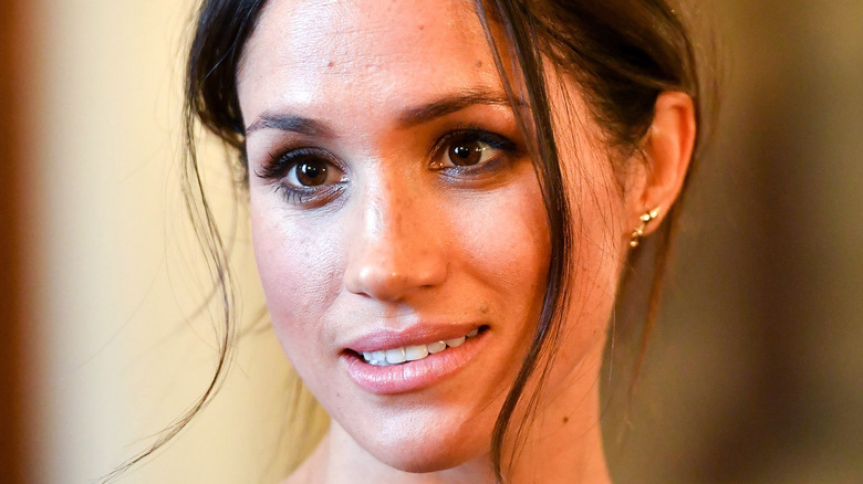 Meghan Markle with a serious expression