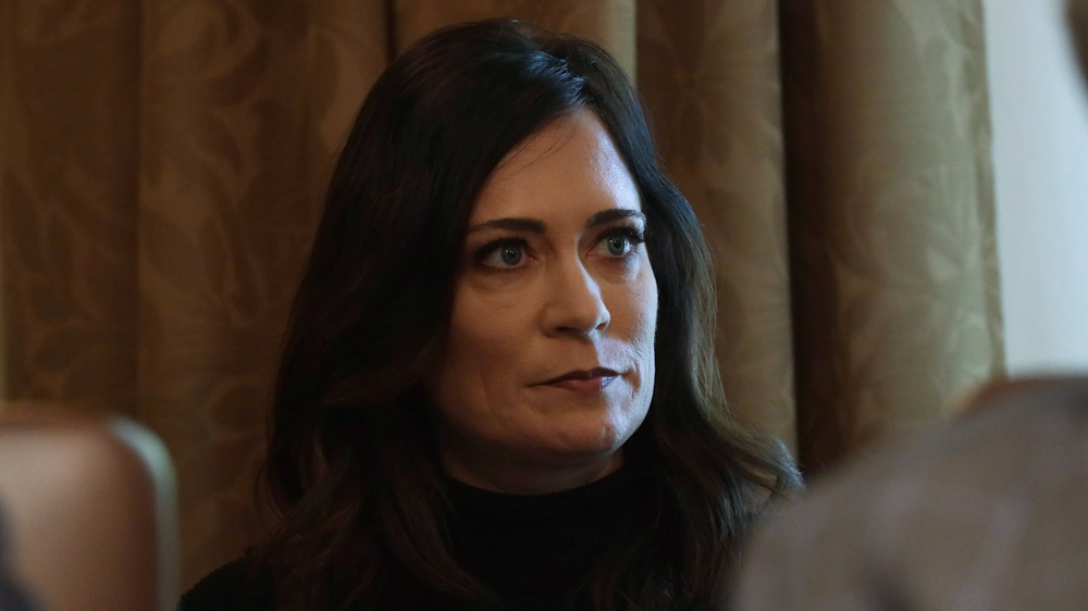 Stephanie Grisham listening during a cabinet meeting