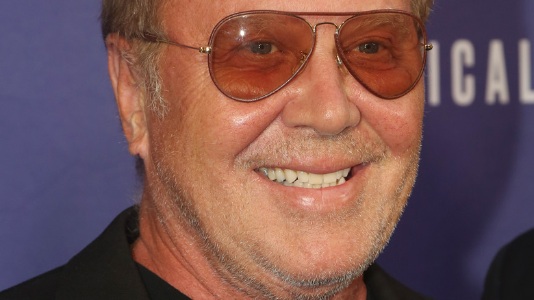 Michael Kors smiles at an event