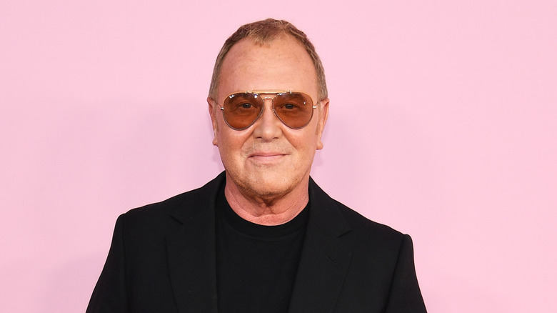 Michael Kors smiles at an event