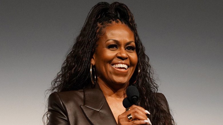 Michelle Obama speaks onstage in 2023