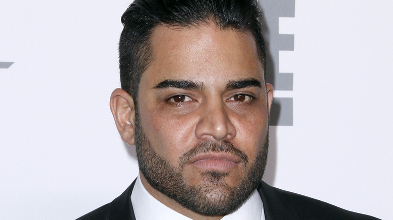 Mike Shouhed posing at a red carpet event