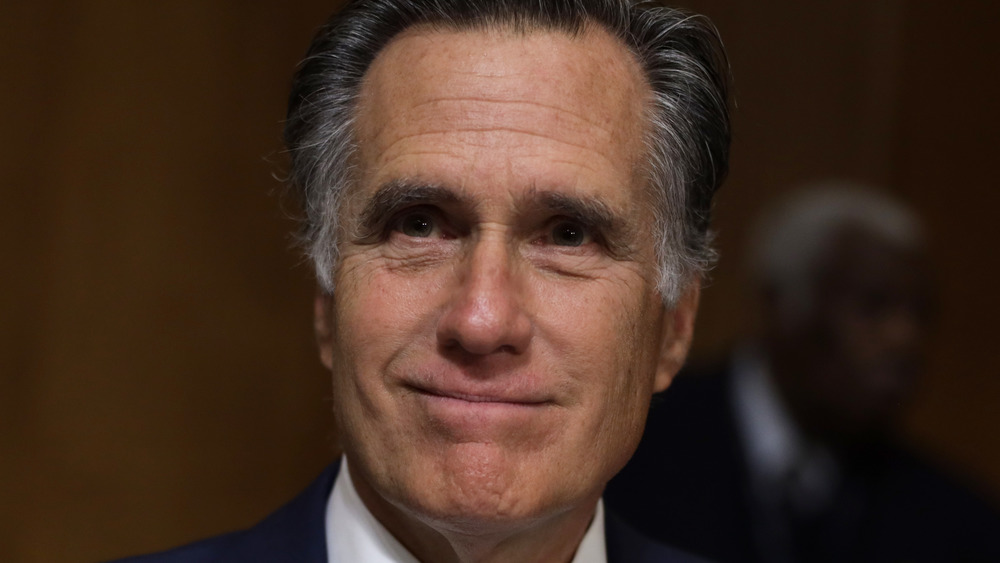 Mitt Romney smiling at an event