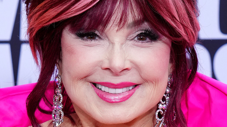 Naomi Judd smiling, pink lipstick