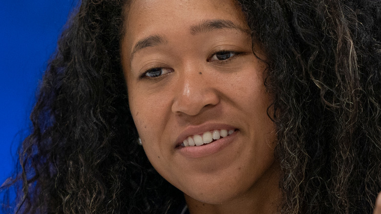 Naomi Osaka smiling after win