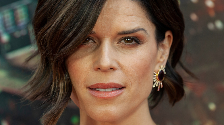 Neve Campbell looking forward with relaxed expression