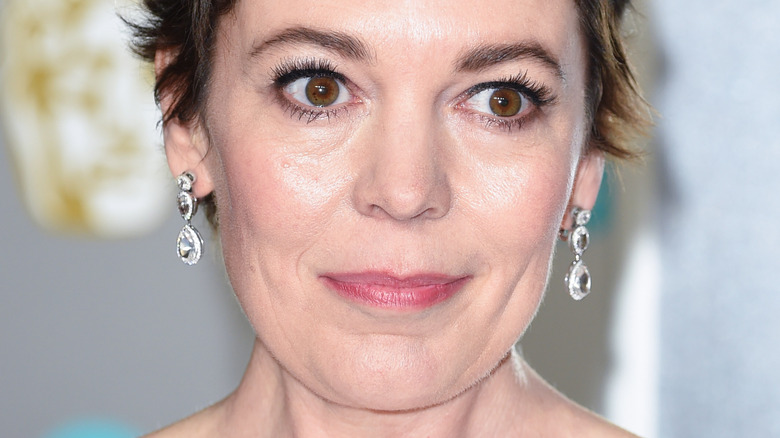 Olivia Colman wearing big earrings