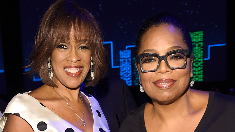 Oprah waving and Gayle King posing