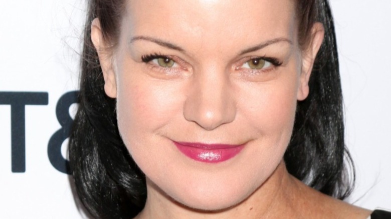 Pauley Perrette smiling at camera