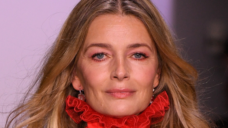 Paulina Porizkova smiles on runway